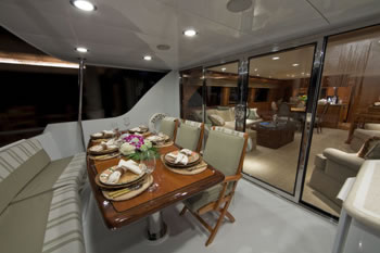 Yacht Temptation aft deck at night