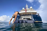 girl jumping off a yacht